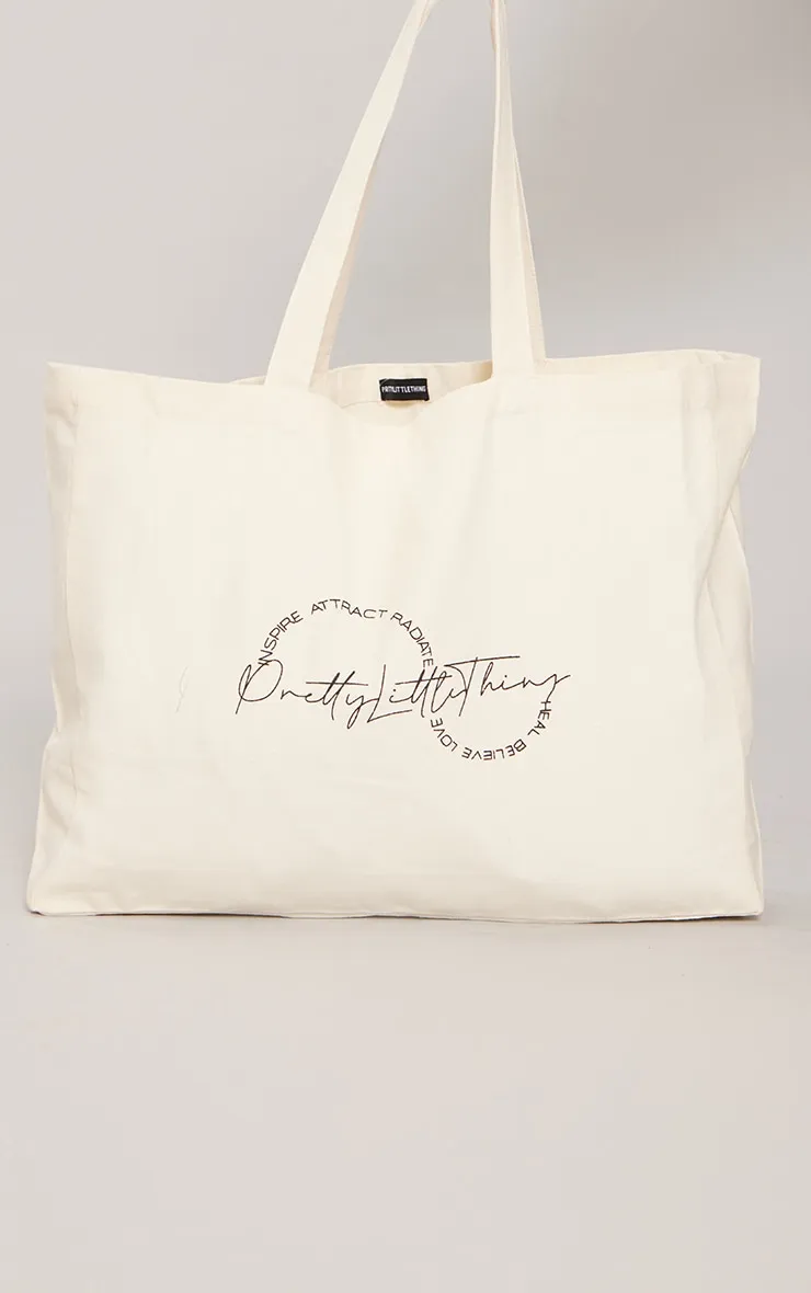 PRETTYLITTLETHING Tote bag en toile crème à affirmation