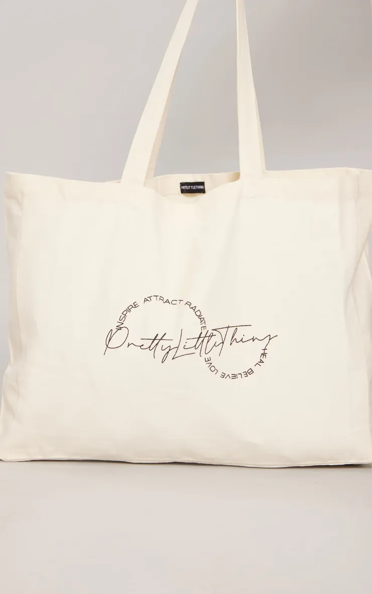 PRETTYLITTLETHING Tote bag en toile crème à affirmation