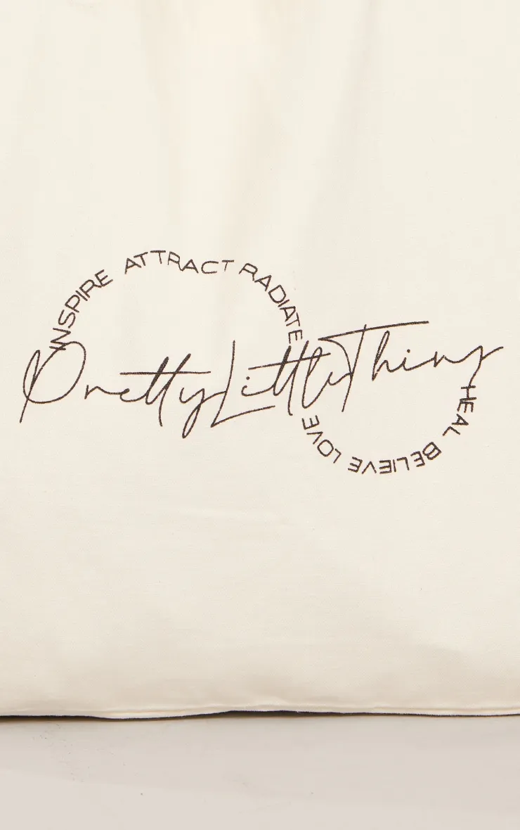 PRETTYLITTLETHING Tote bag en toile crème à affirmation